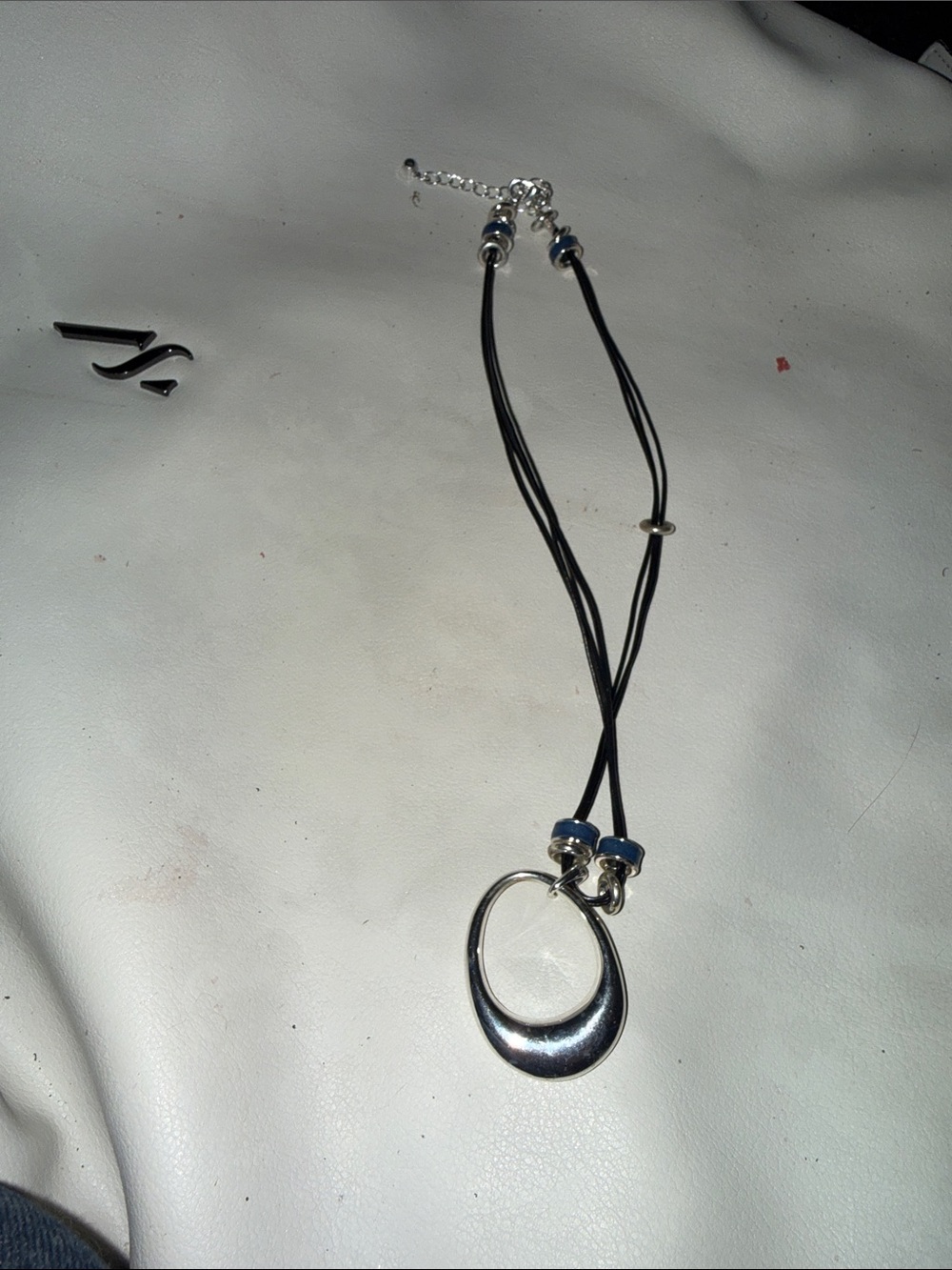 White House Black Market Silver Crescent Pendant on Black Cord